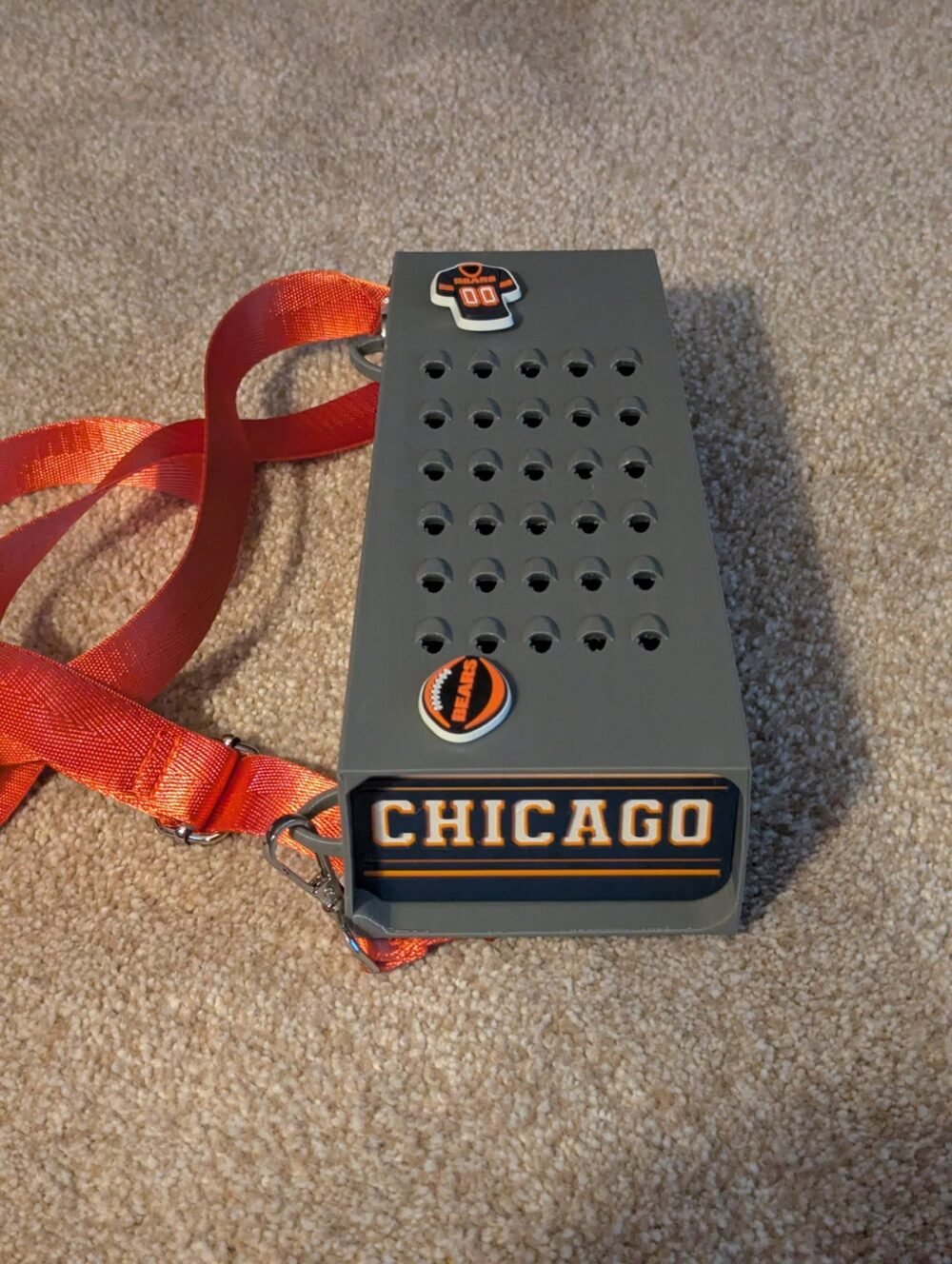 Grater Purse with a Chicago team-themed baseplate and orange strap