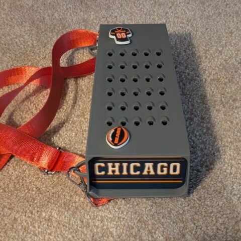 Grater Purse with a Chicago team-themed baseplate and orange strap
