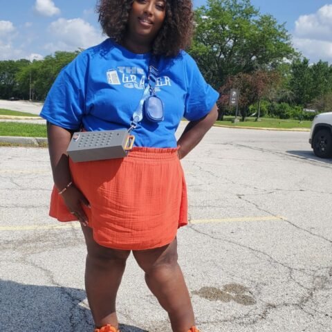 female wearing cheese grater purse